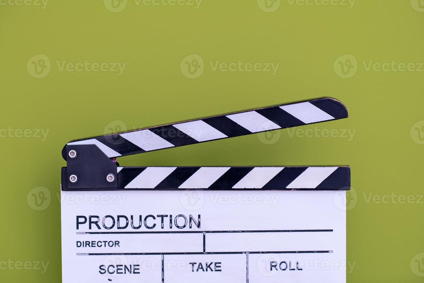movie clapper on green chroma background photo