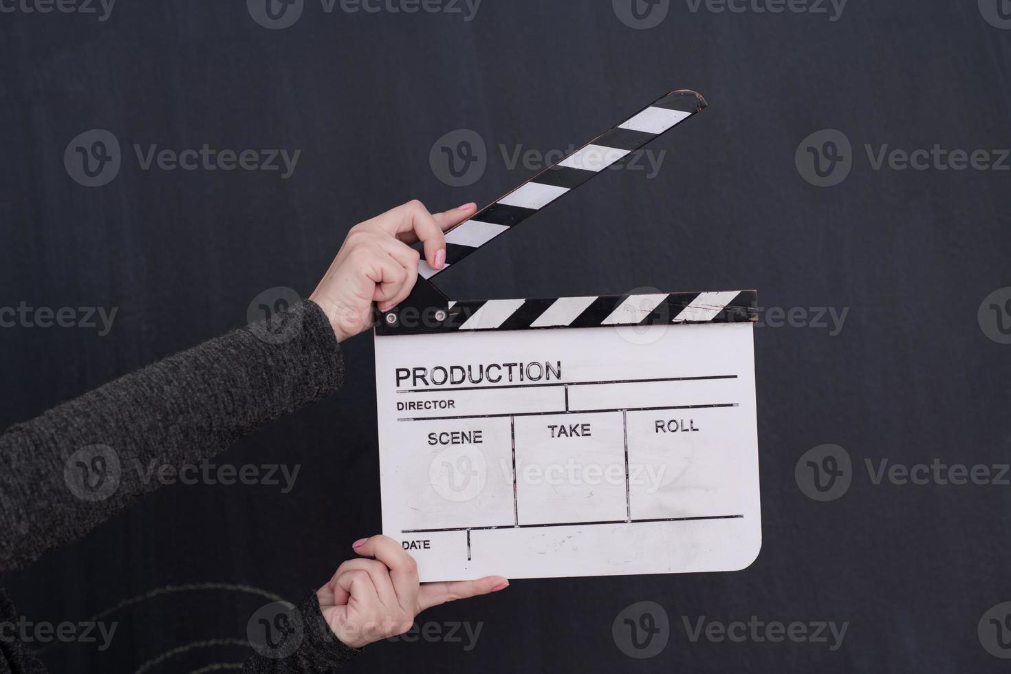 movie clapper on balck chalkboard background photo