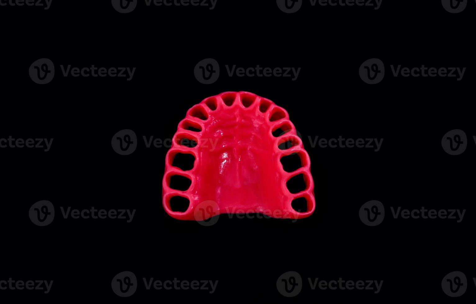 model of human gums without teeth isolated on black photo