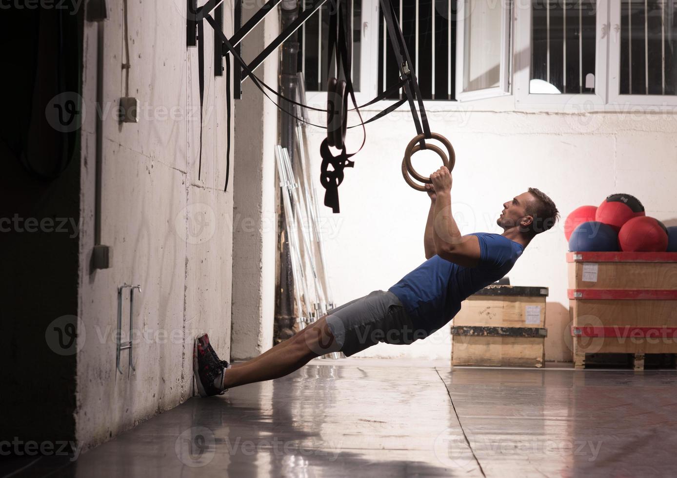 man doing dipping exercise photo