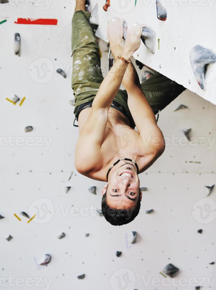 Man rock climbing photo