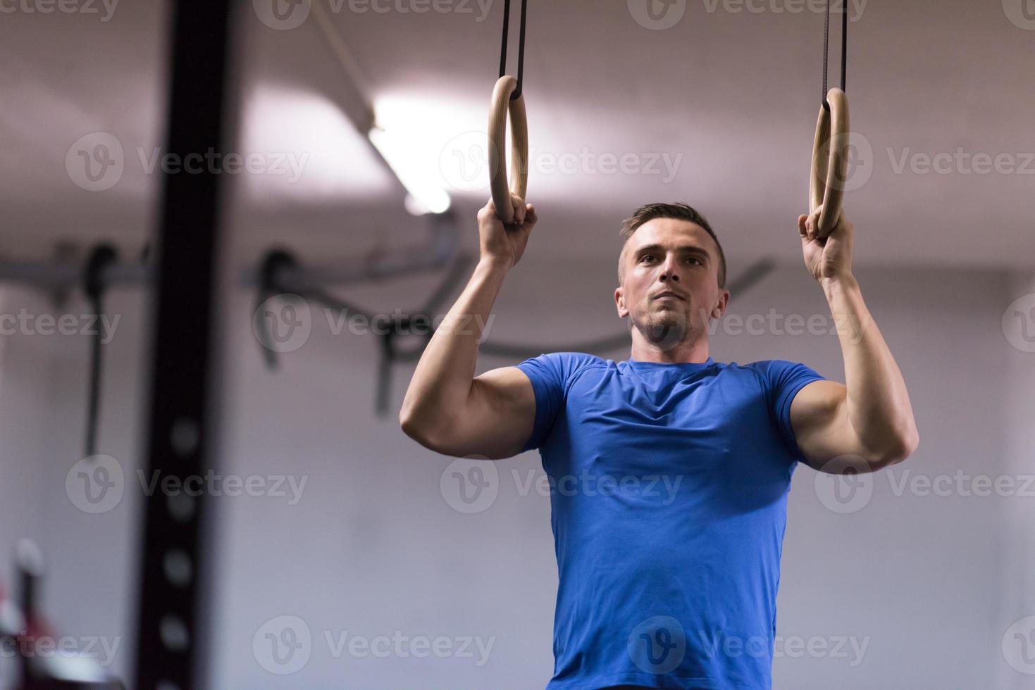man doing dipping exercise photo