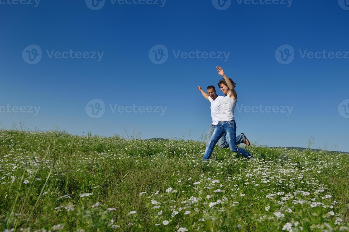 happy couple in wheat field photo