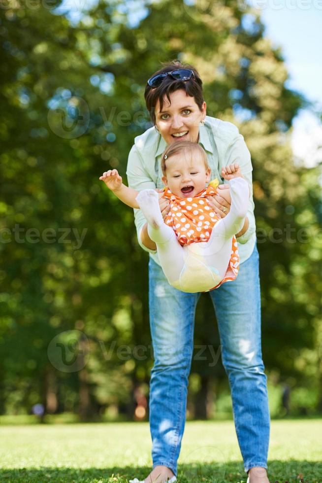 mother and baby in park photo