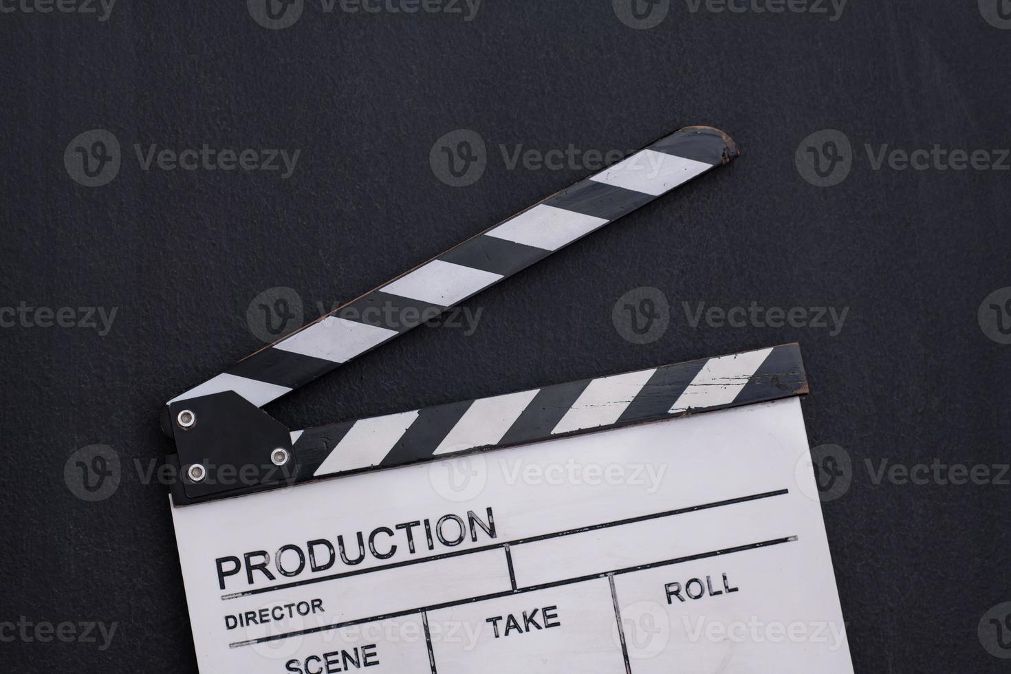 movie clapper on balck chalkboard background photo