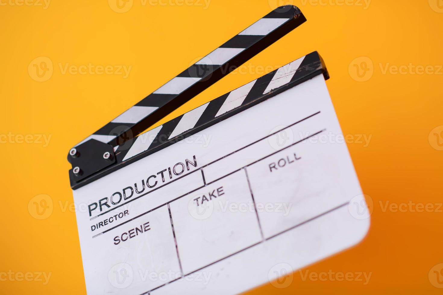 movie clapper on yellow background photo