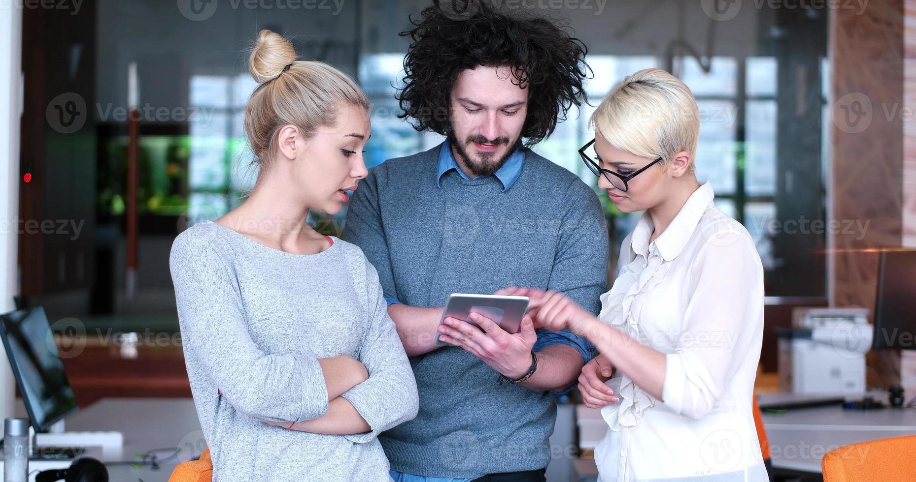 Startup Business Team At A Meeting at modern office building photo