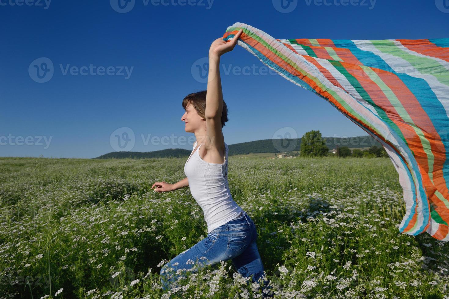 young woman in wheat field at summer photo