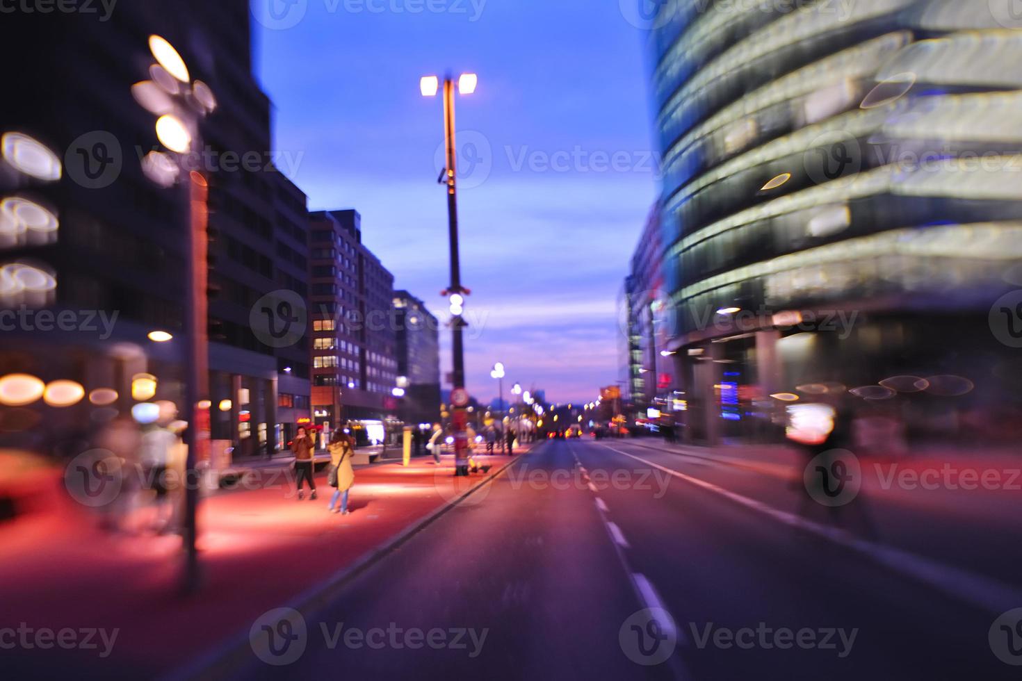 City night with cars motion blurred light in busy street photo