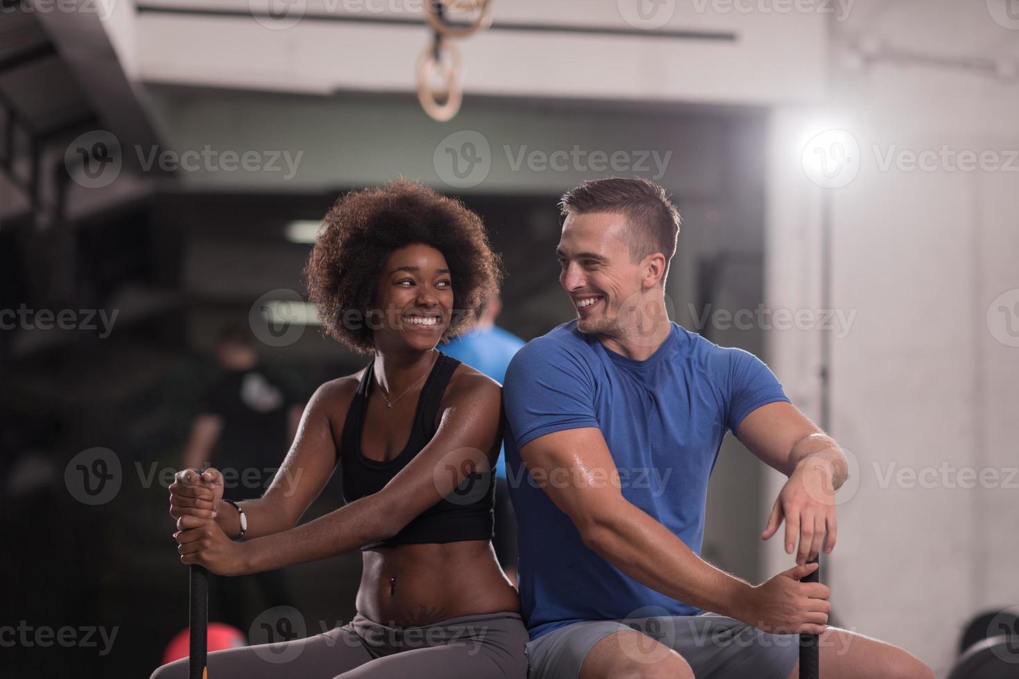 multiethnic couple after workout with hammer photo