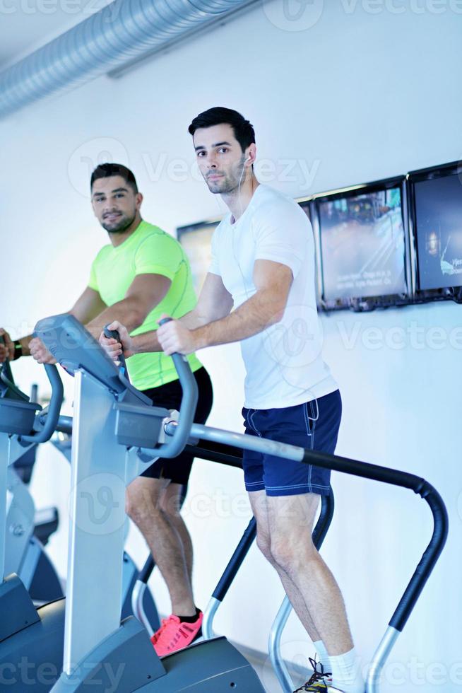 Group of people running on treadmills photo