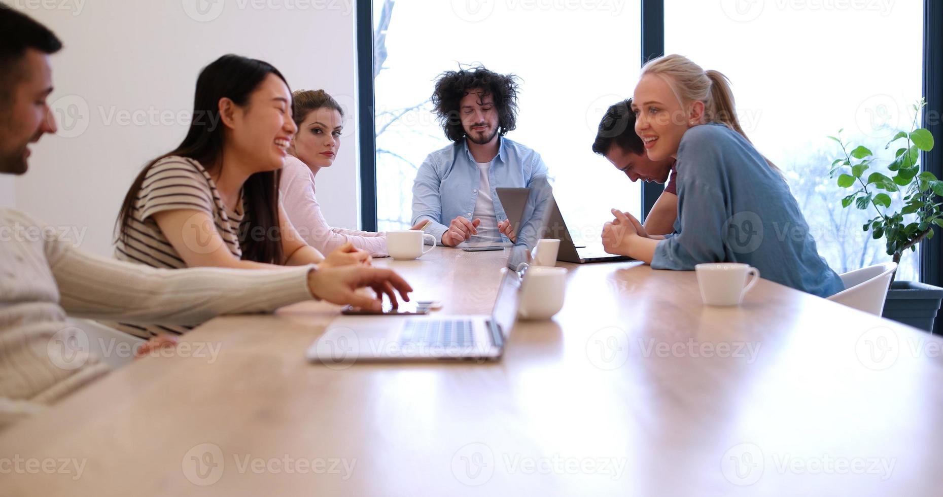 Startup Business Team At A Meeting at modern office building photo