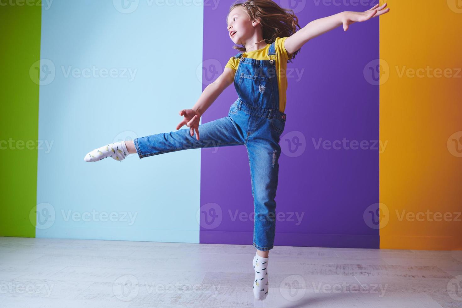 Cute little girl dancing at home photo