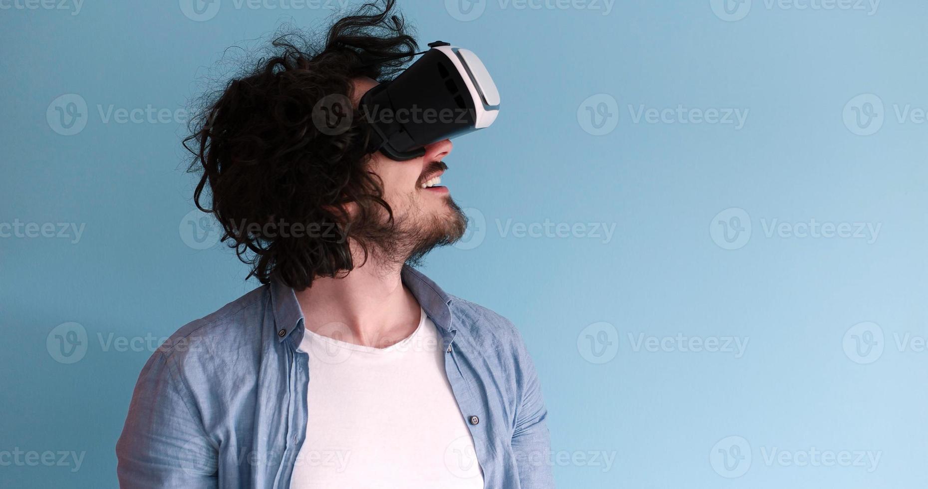 man using VR headset glasses of virtual reality photo