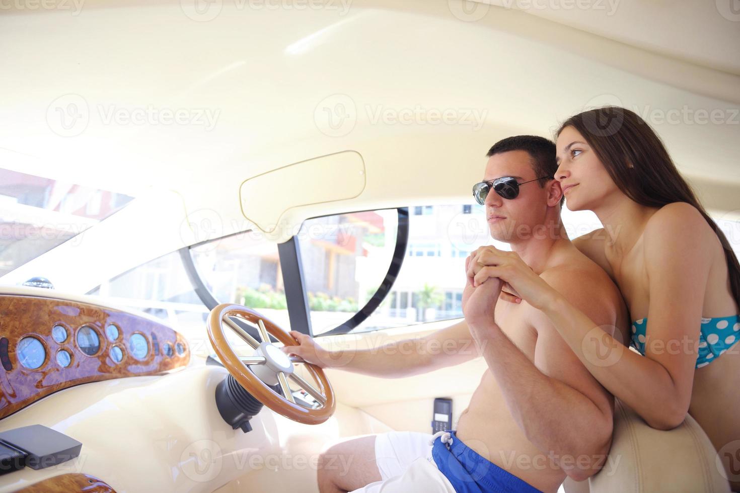 young couple on yacht photo