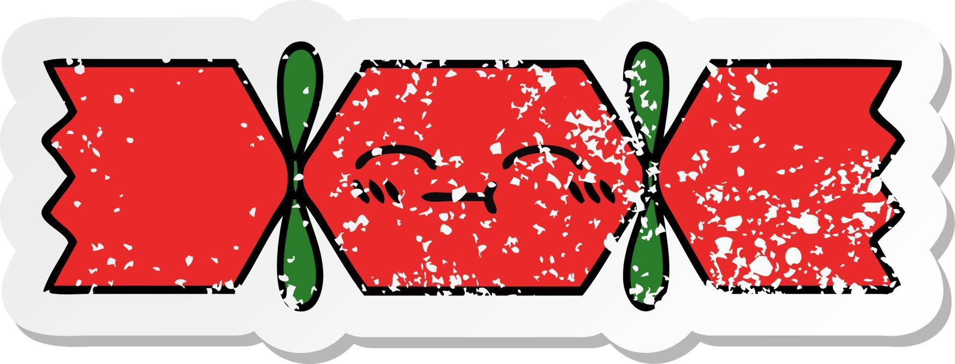 distressed sticker of a cute cartoon christmas cracker vector