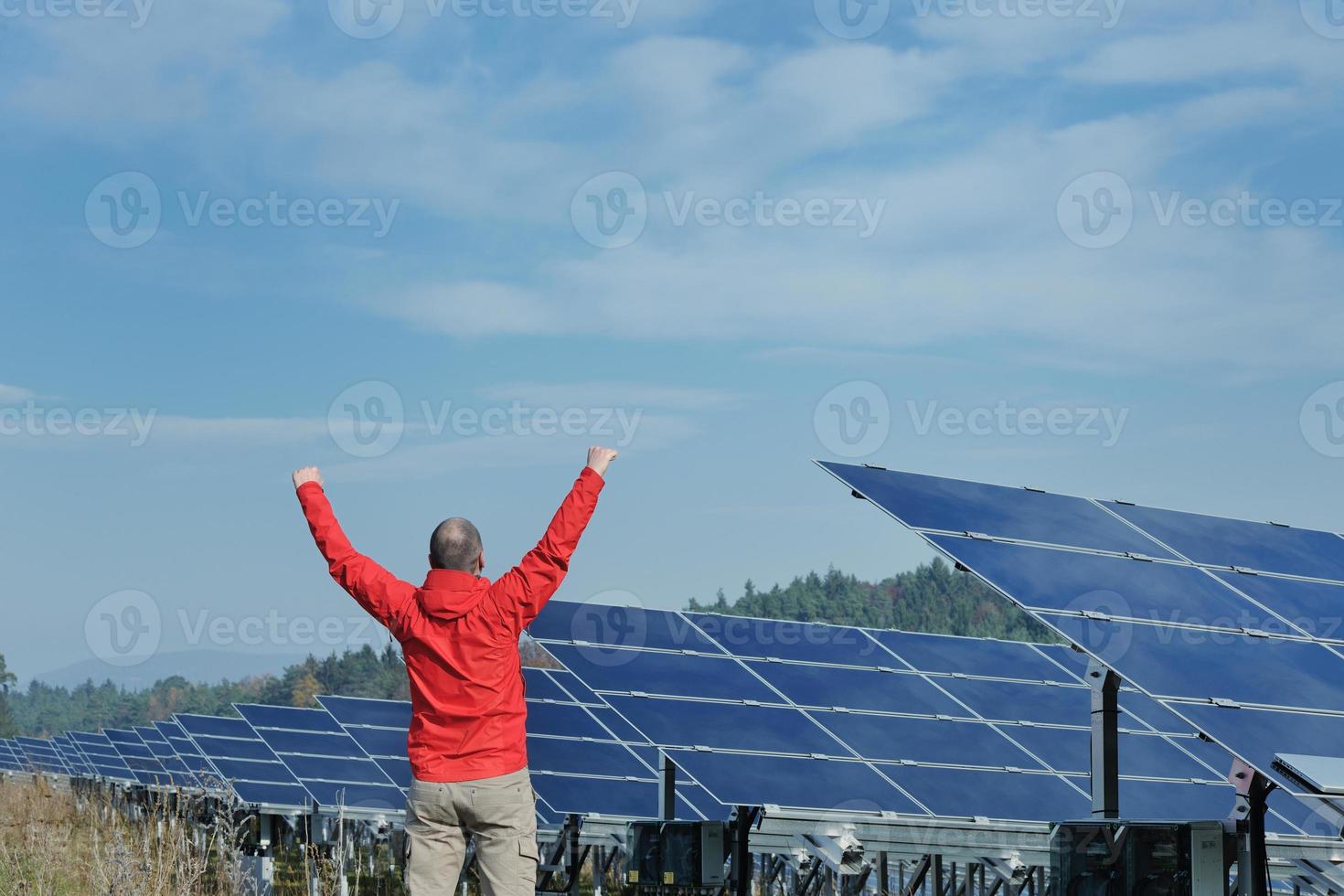 Male solar panel engineer at work place photo