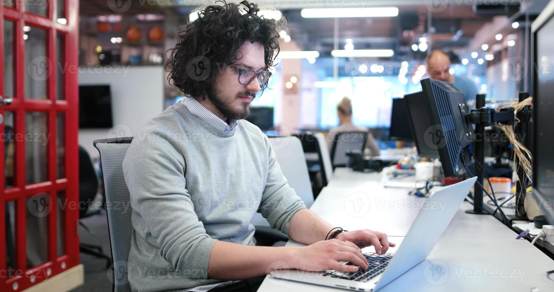 businessman working using a laptop in startup office photo