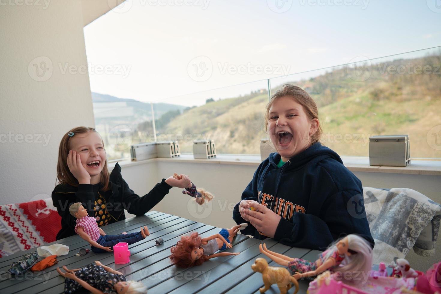 little girls playing with dolls photo