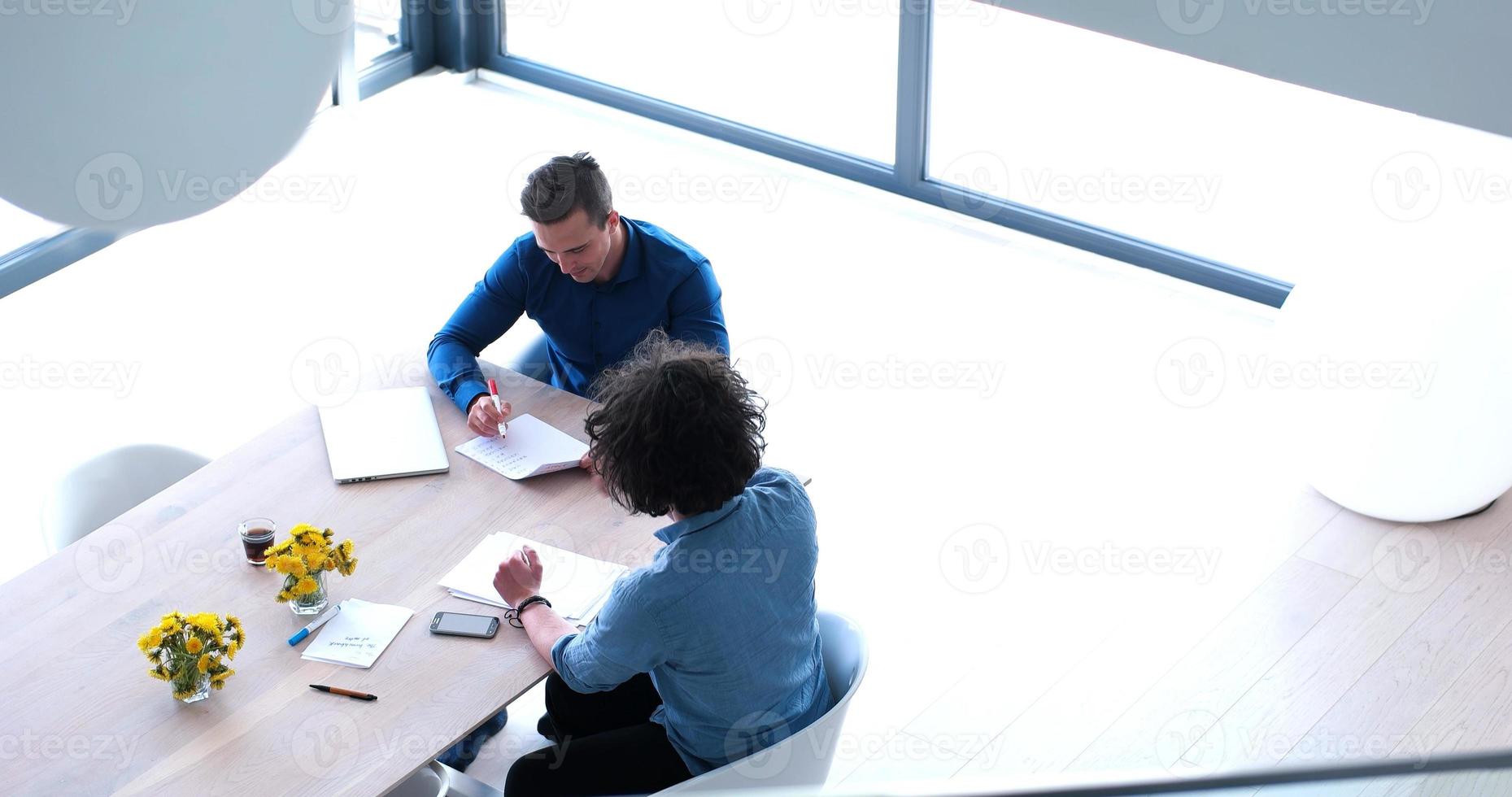 Startup Business Team At A Meeting at modern office building photo