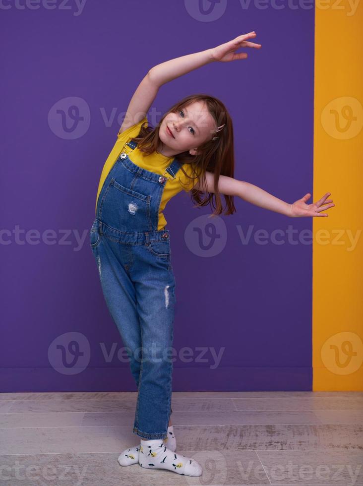 Cute little girl dancing at home photo