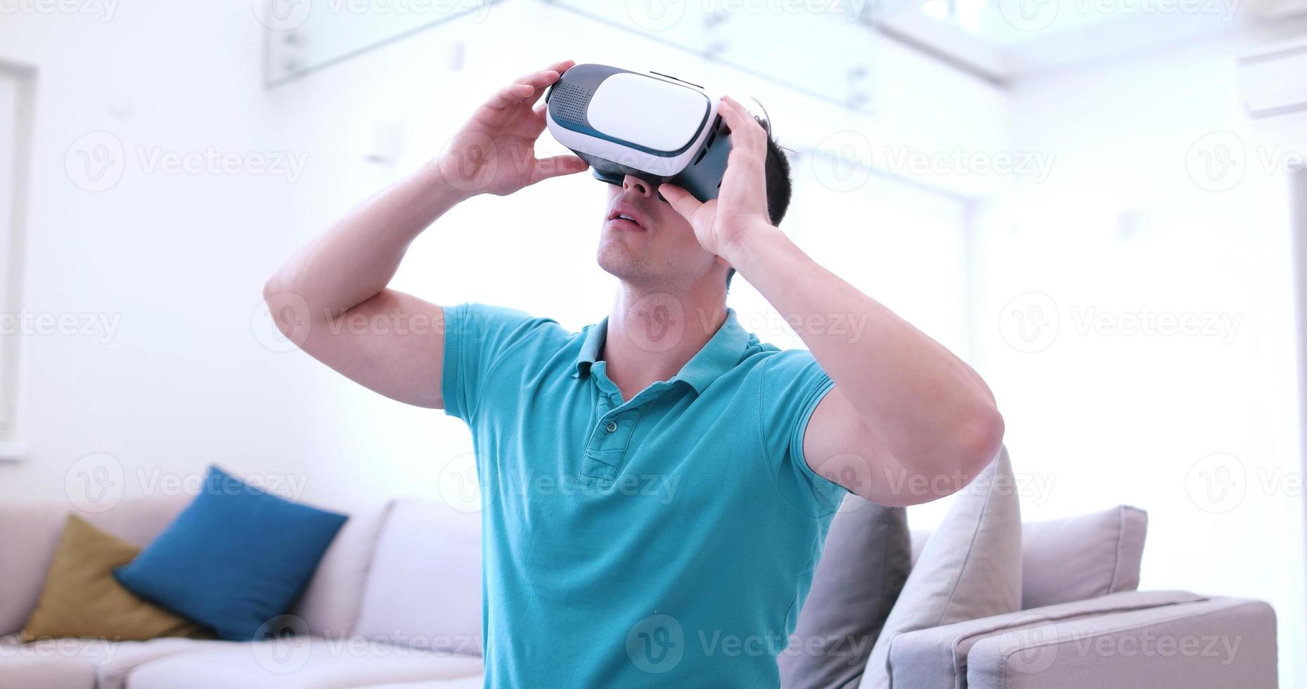 man using VR-headset glasses of virtual reality photo