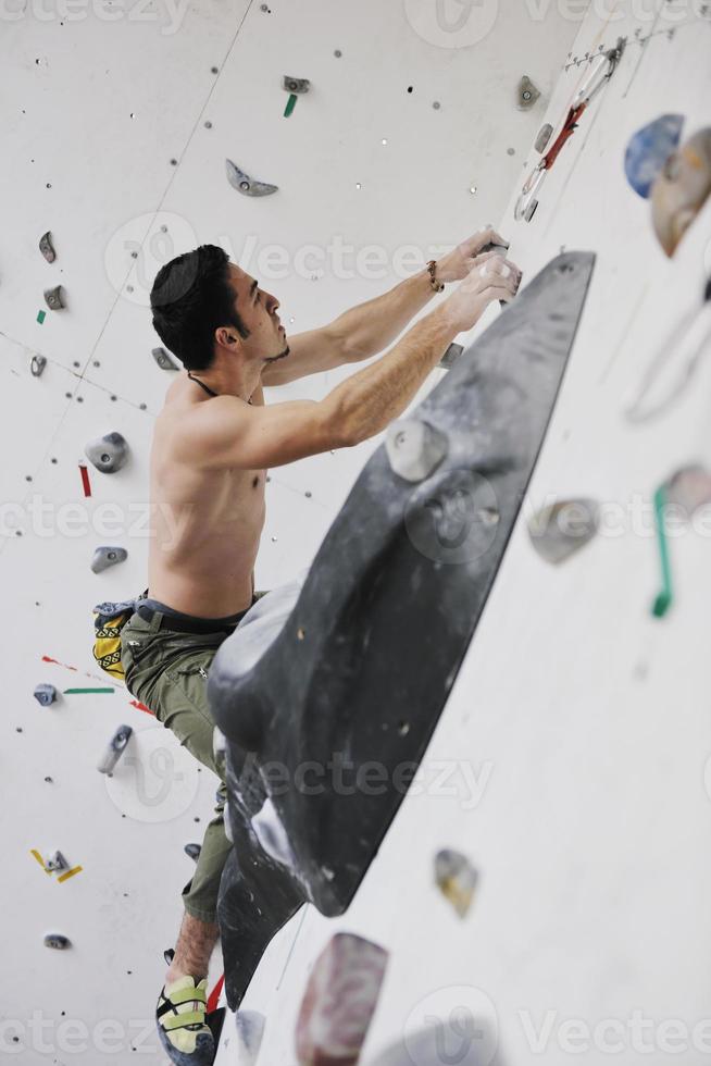 Man rock climbing photo