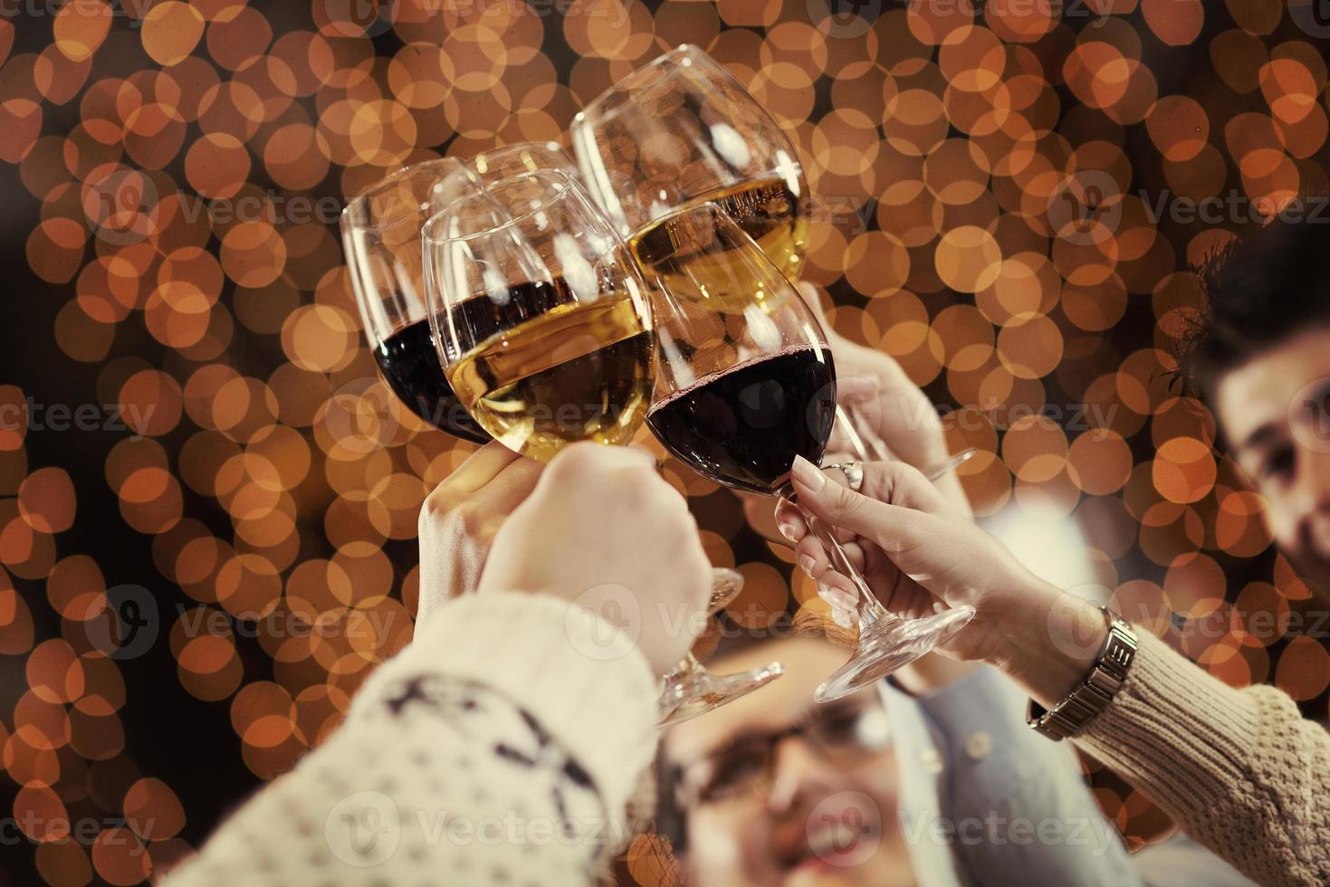 Hands holding the glasses of champagne and win photo