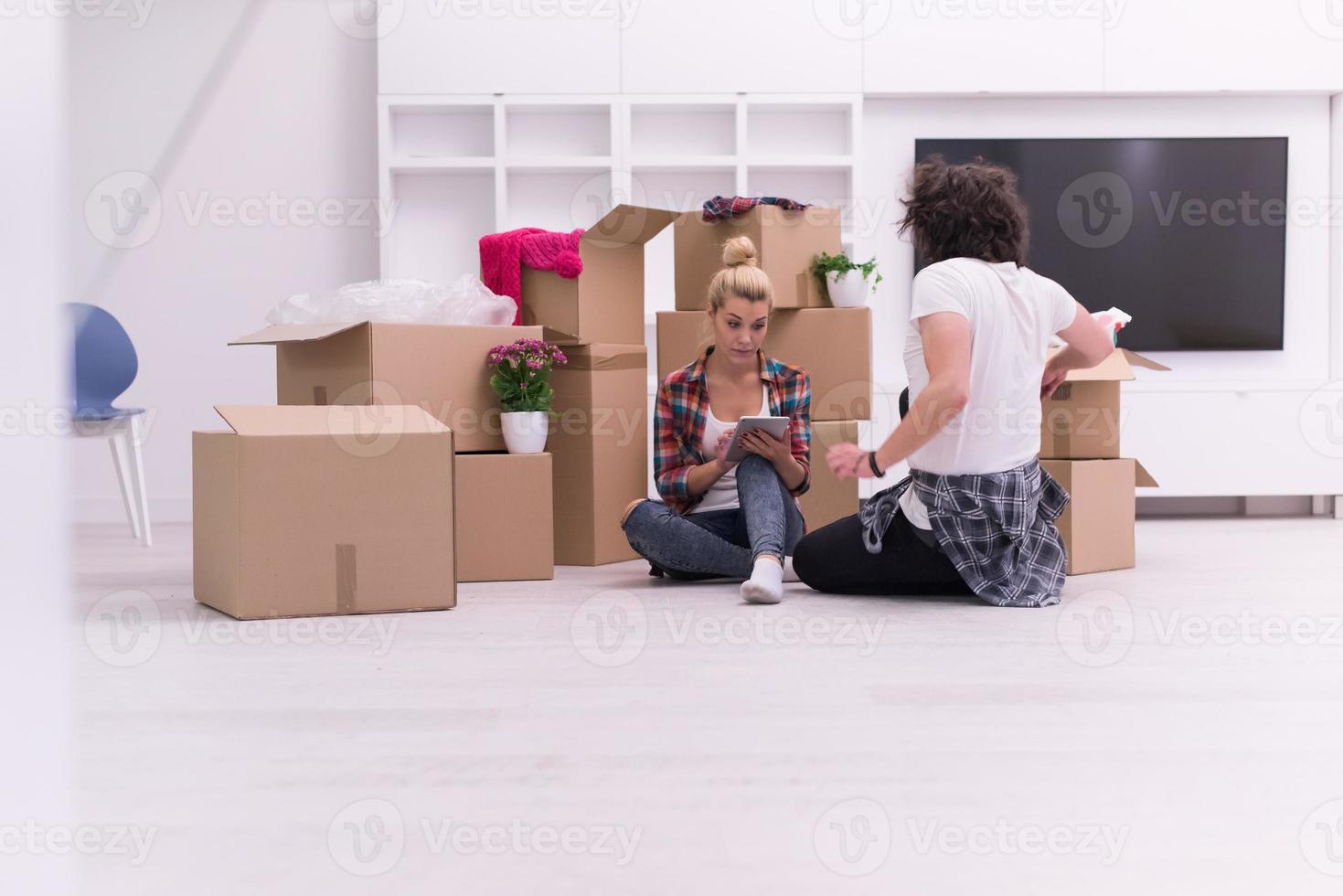 young couple moving  in new house photo