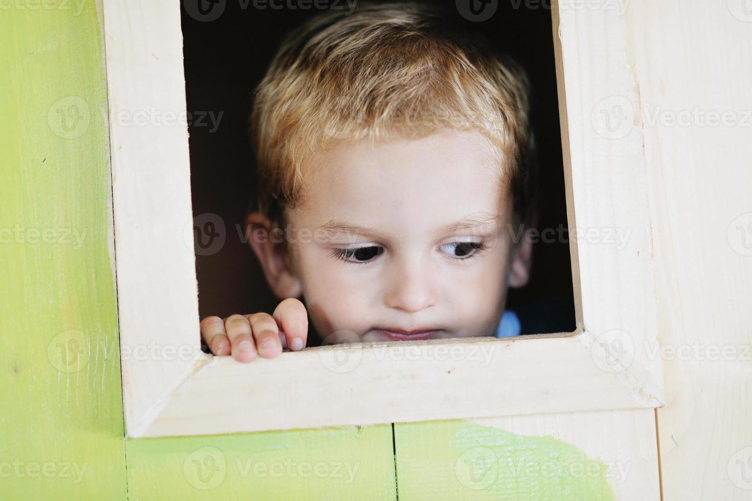 happy child in a window photo