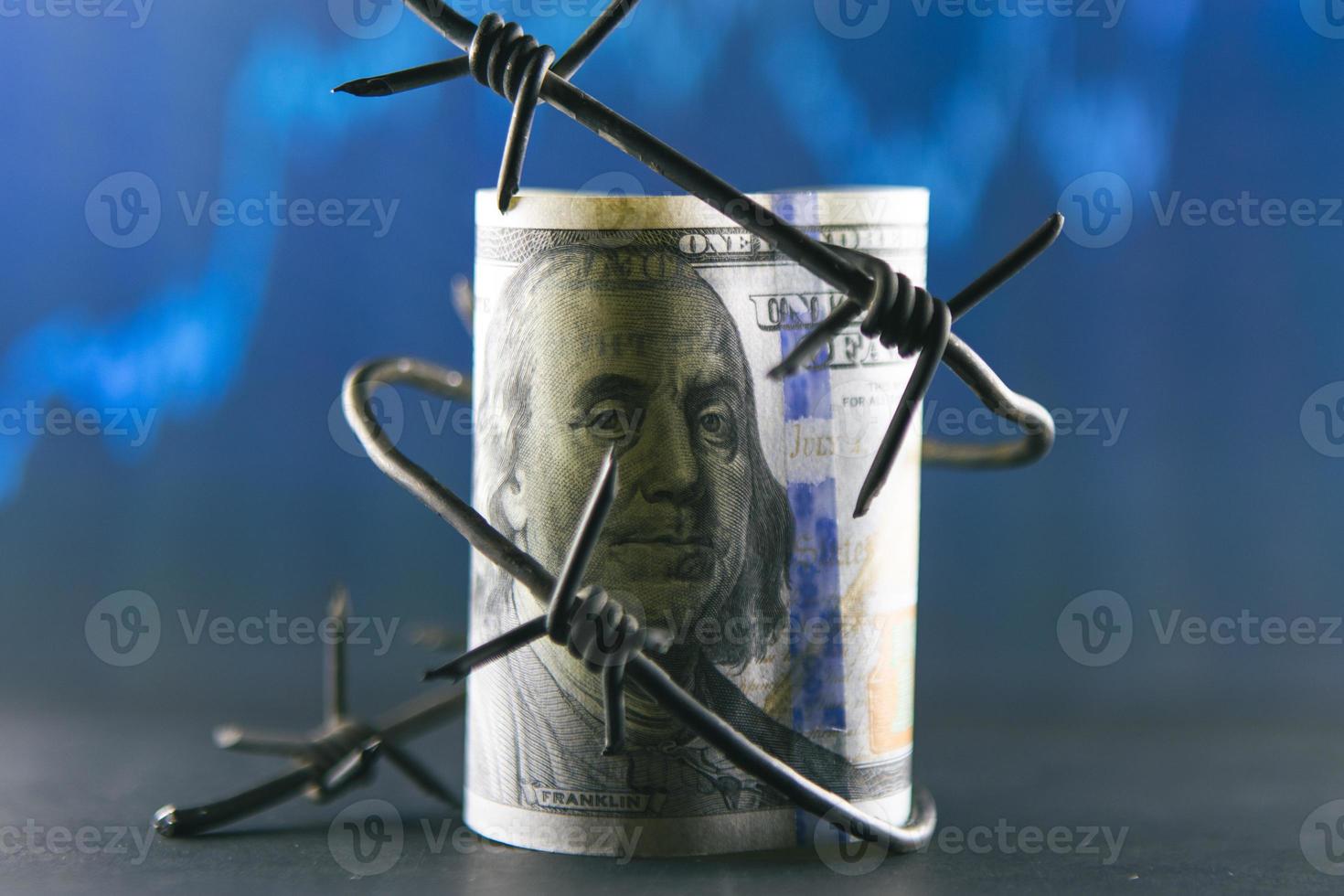 Dollar banknote with barbed wire, Economic crisis, background effect with little noise photo