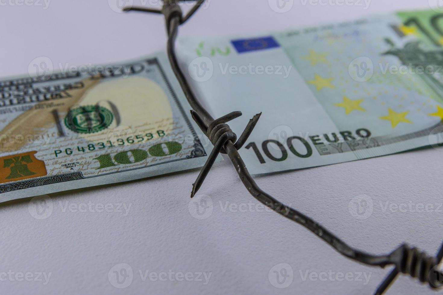 Euro Dollar Conflicts, banknote Dollar and banknote Euro, Euro vs Dollar with barbed wire, Economic crisis photo