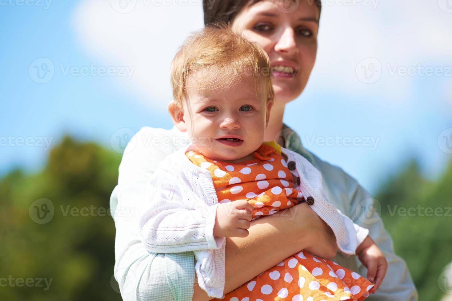 mother and baby in park photo