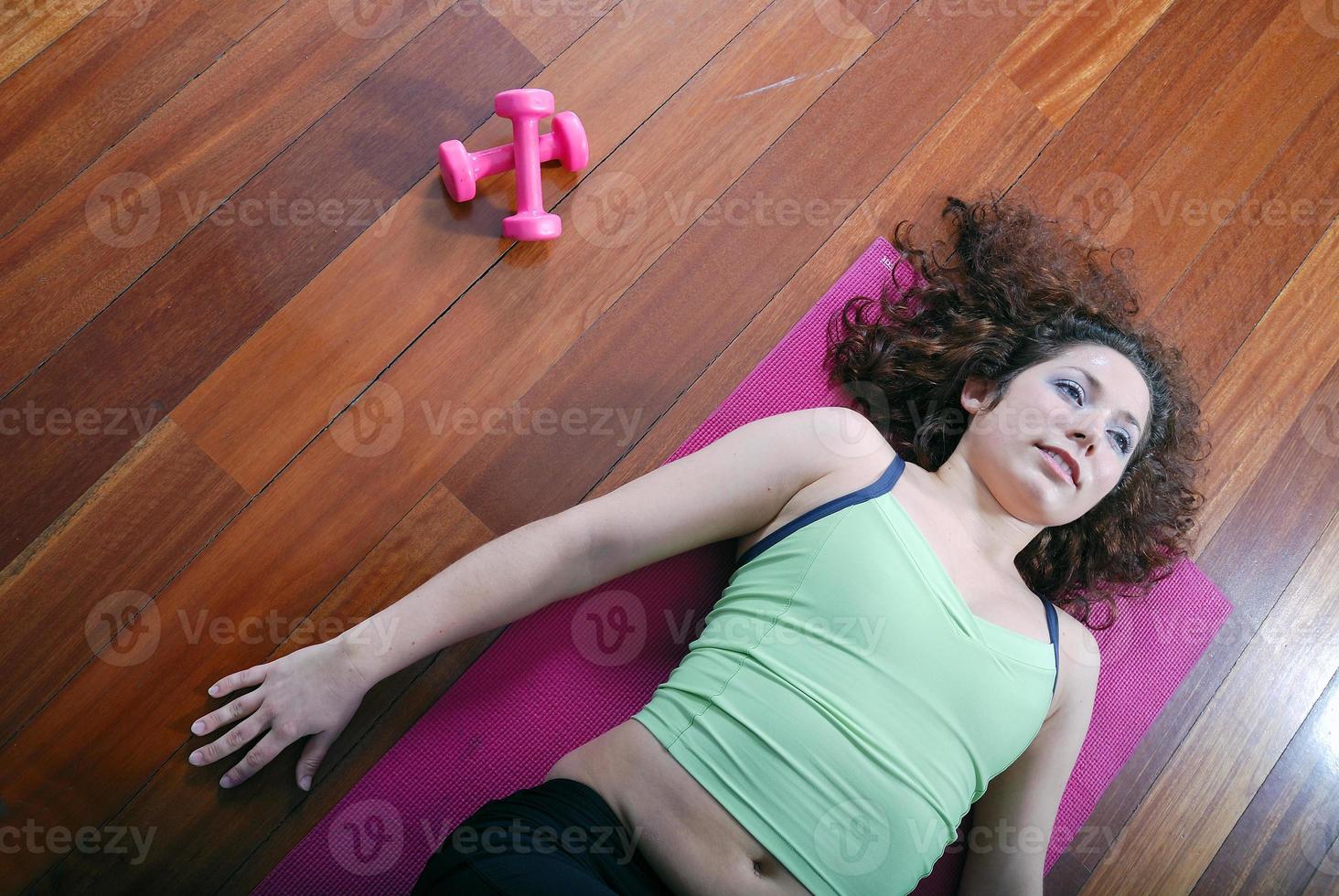 young pretty woman exercising in a fitness center photo