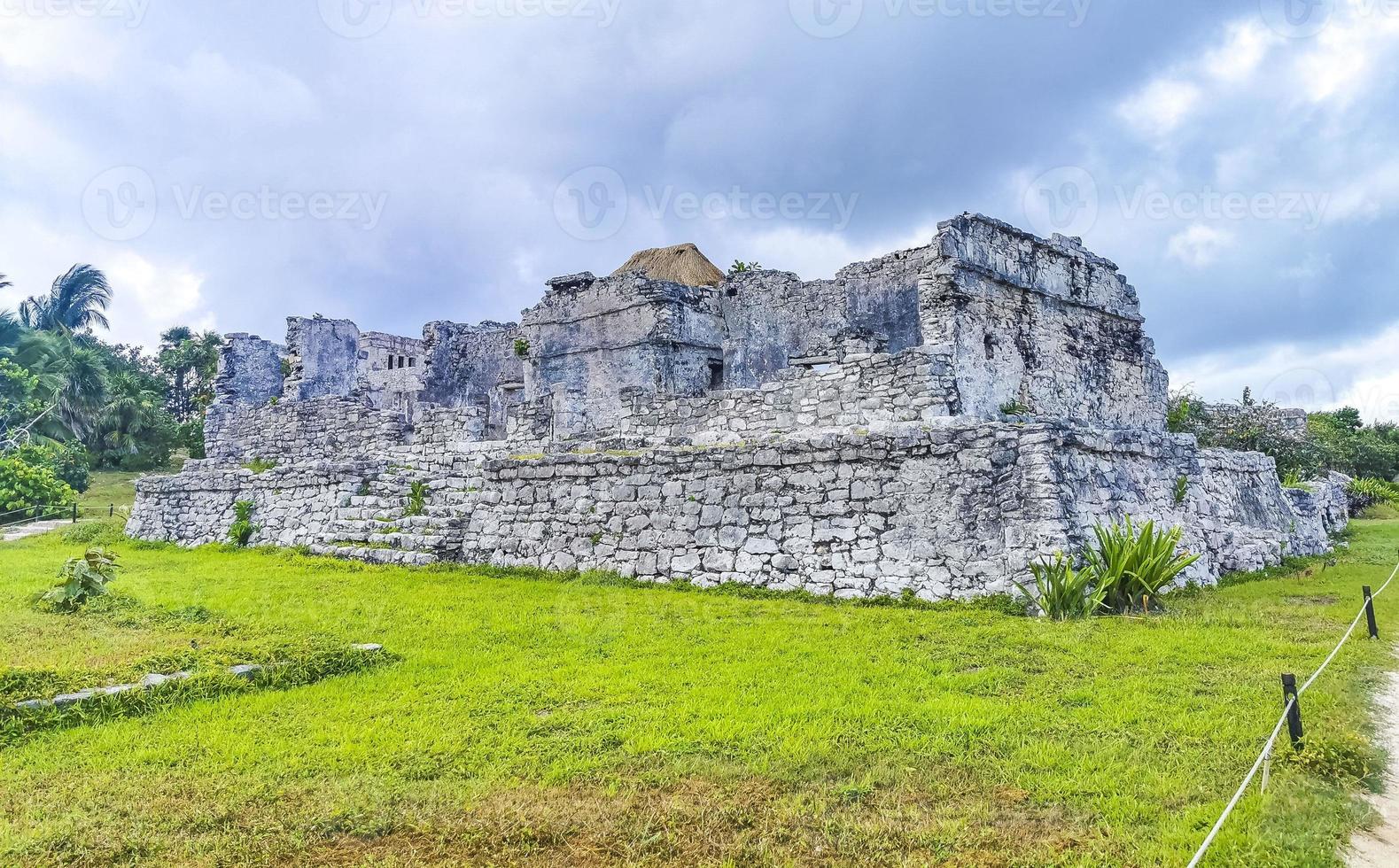 Ancient Tulum ruins Mayan site temple pyramids artifacts seascape Mexico. photo