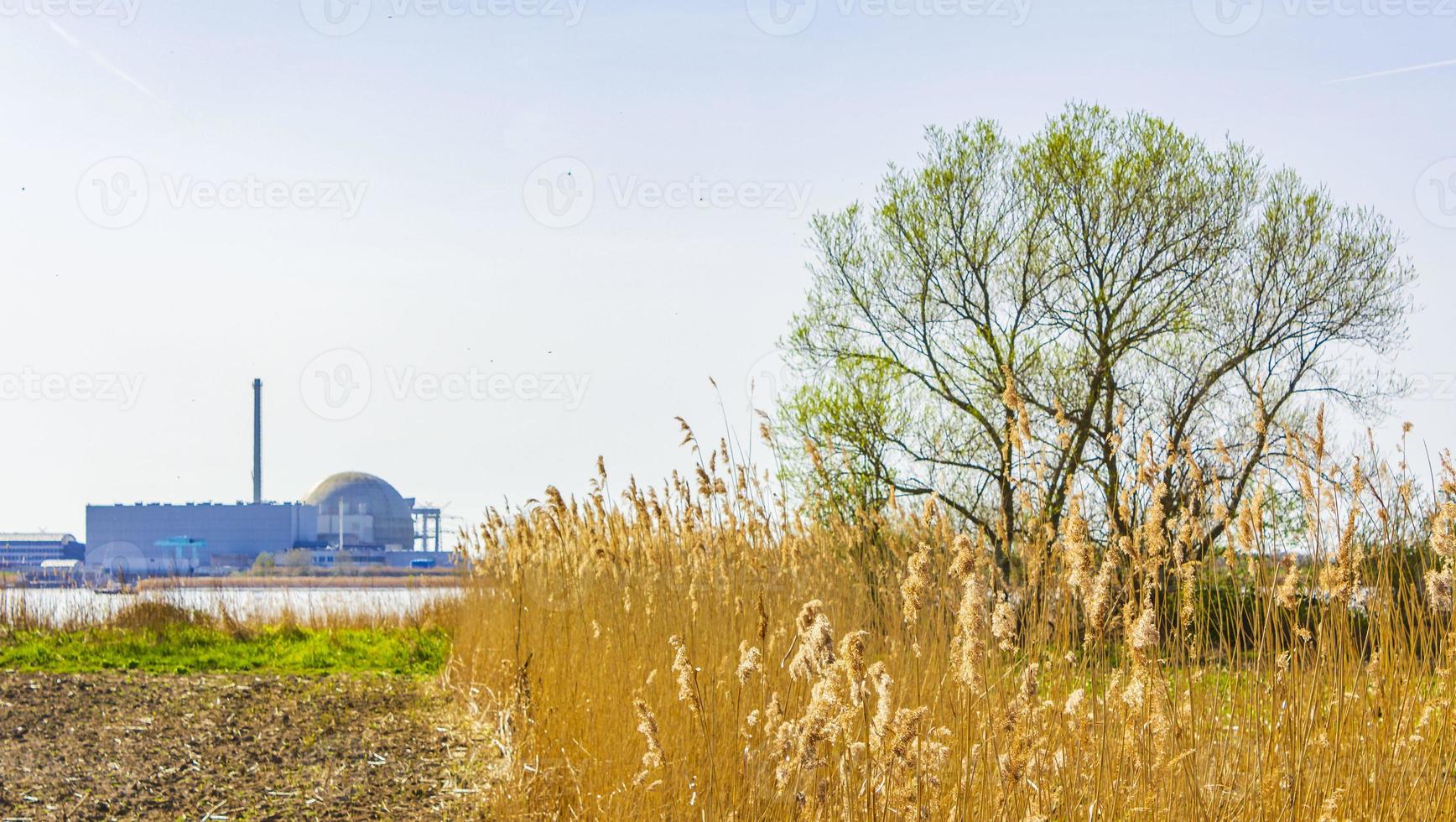 Atomic nuclear power station wadden sea tidelands coast landscape Germany. photo