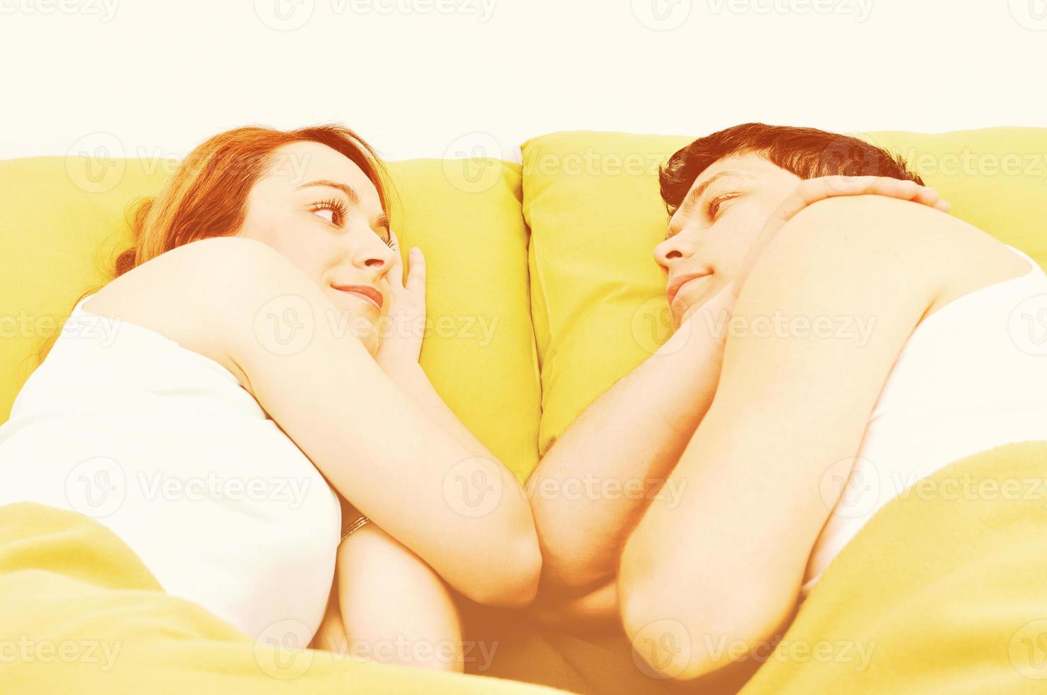 young couple in bed photo