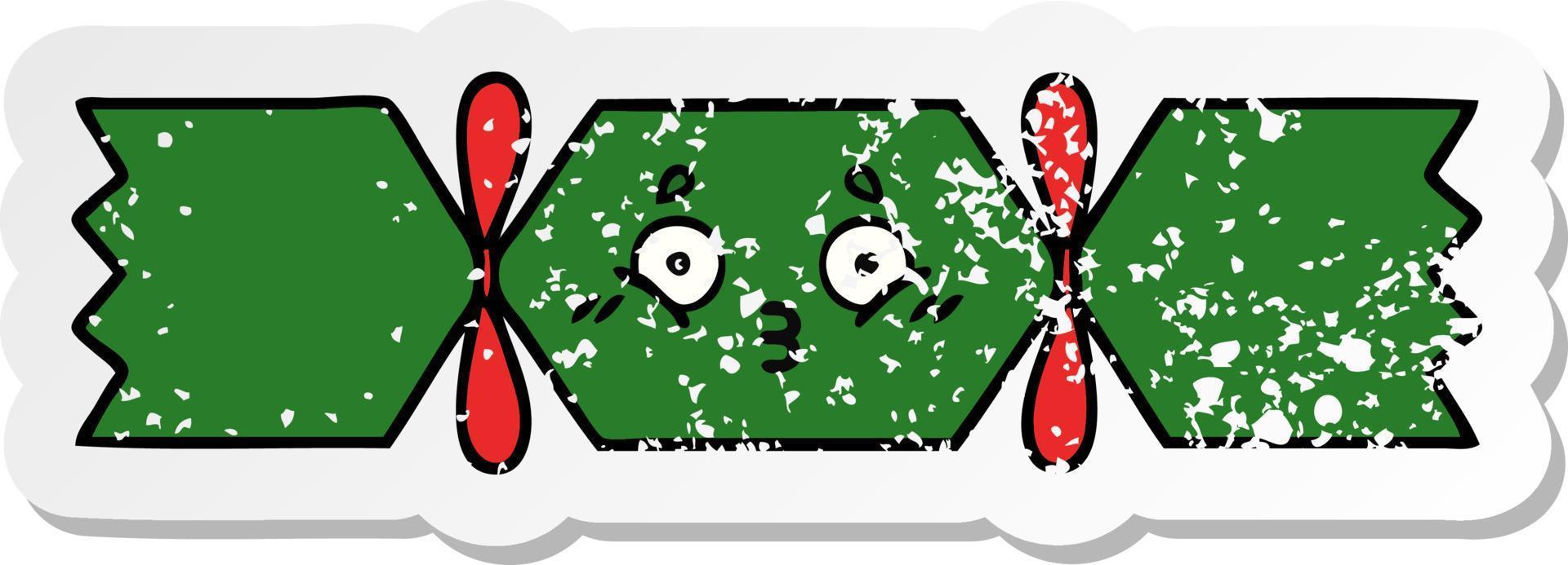 distressed sticker of a cute cartoon christmas cracker vector