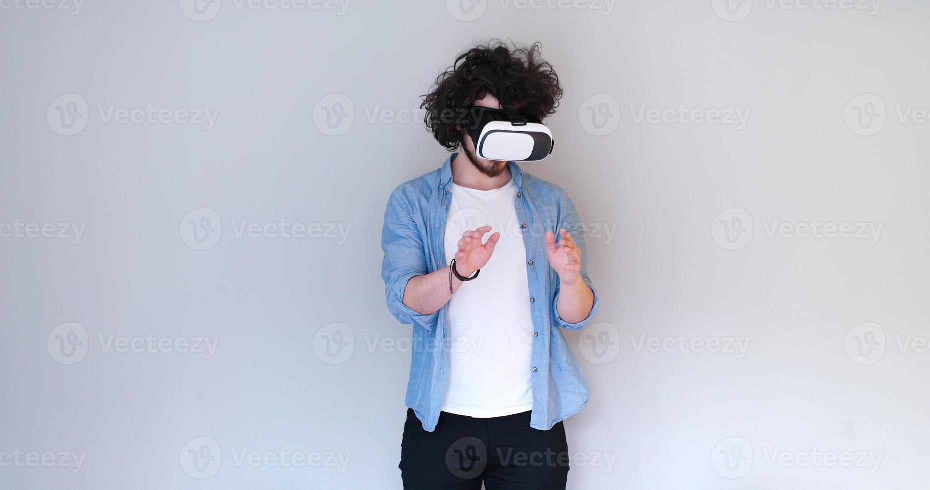 Man using headset of virtual reality photo