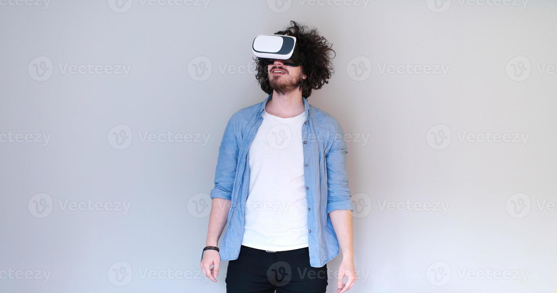 Man using headset of virtual reality photo