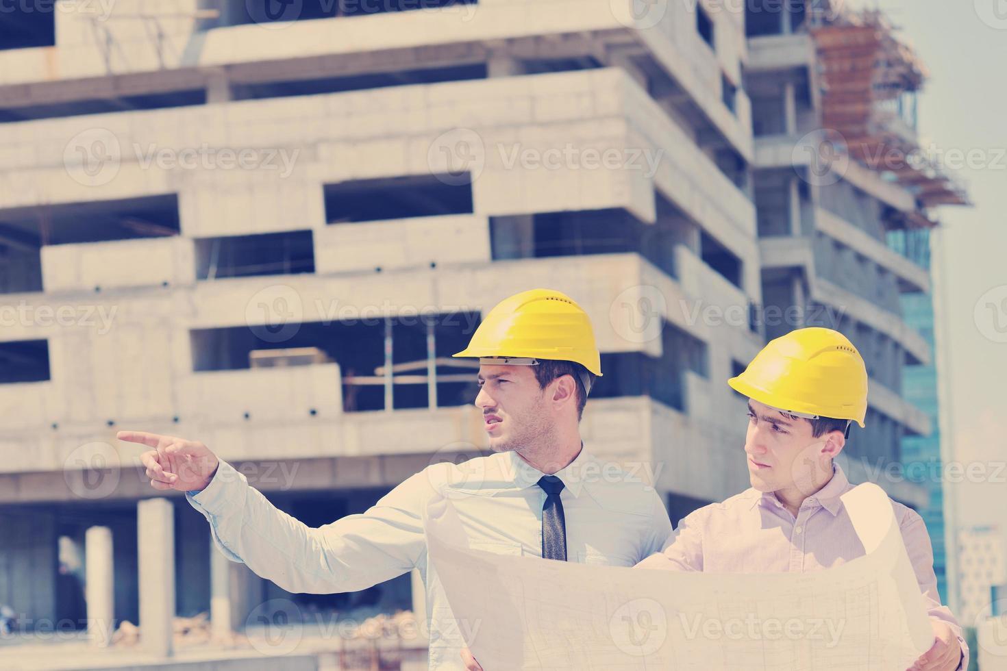 Team of architects on construciton site photo