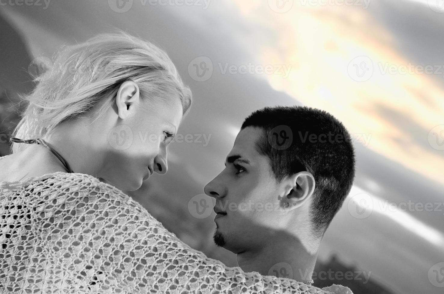 romantic urban couple dancing on top of  bulding photo