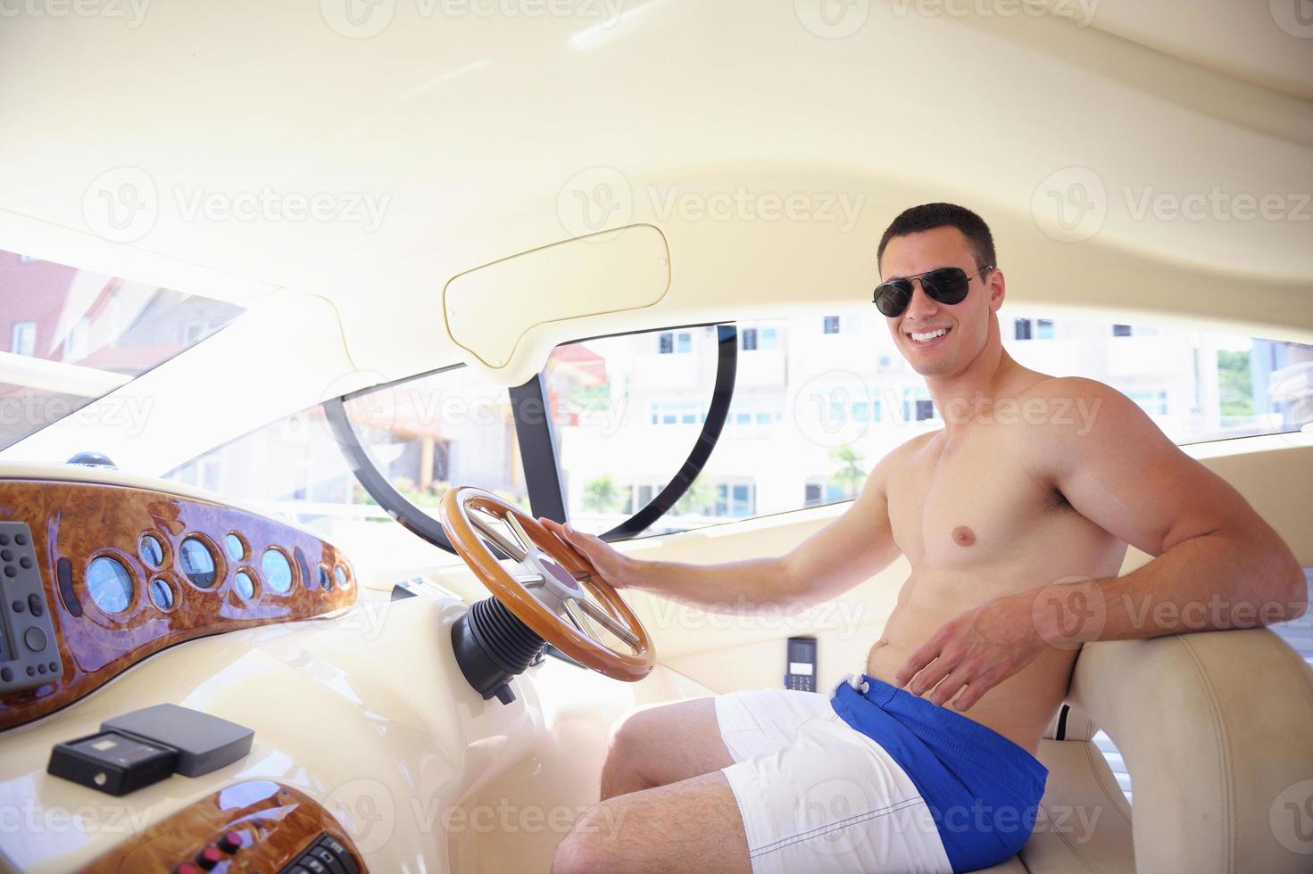 young man on yacht photo
