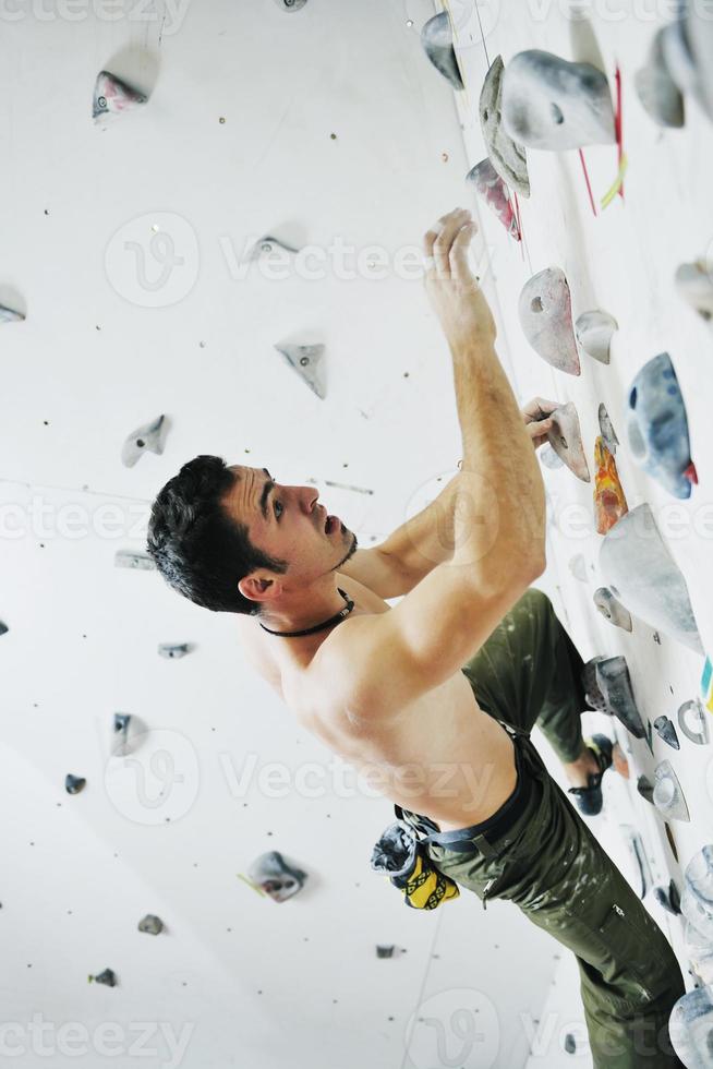 Man rock climbing photo