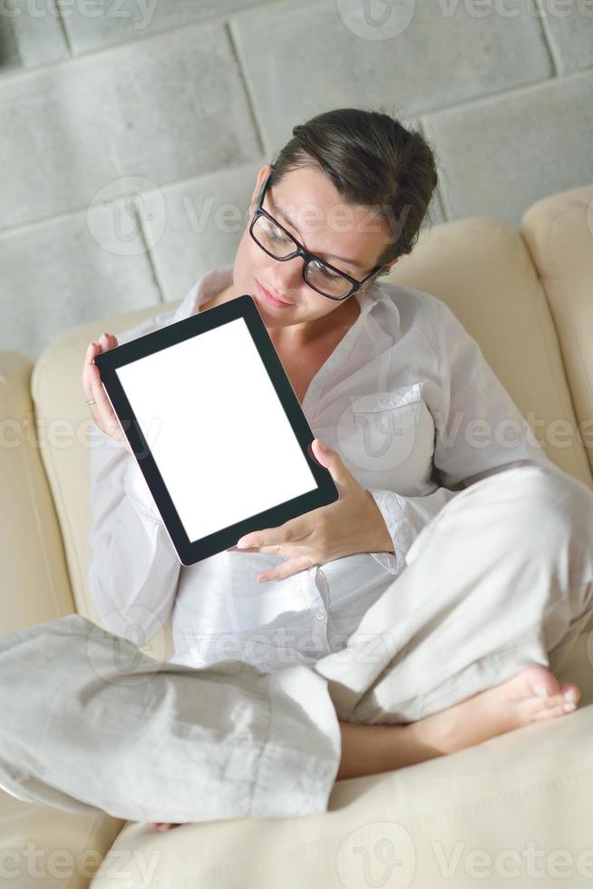 woman using tablet pc at home photo