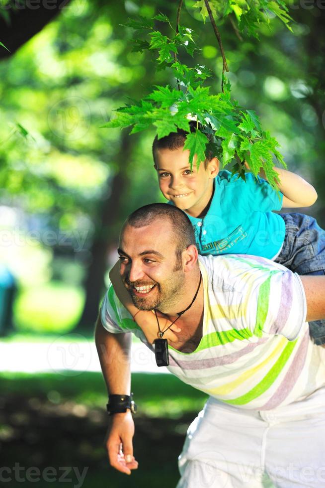 happy father and son have fun at park photo