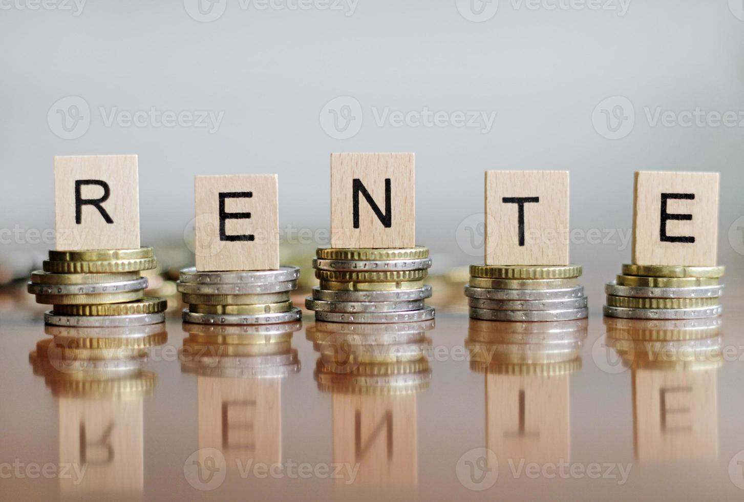 Stacks of coin with the word RENTE - German for pension - spelled out on top photo