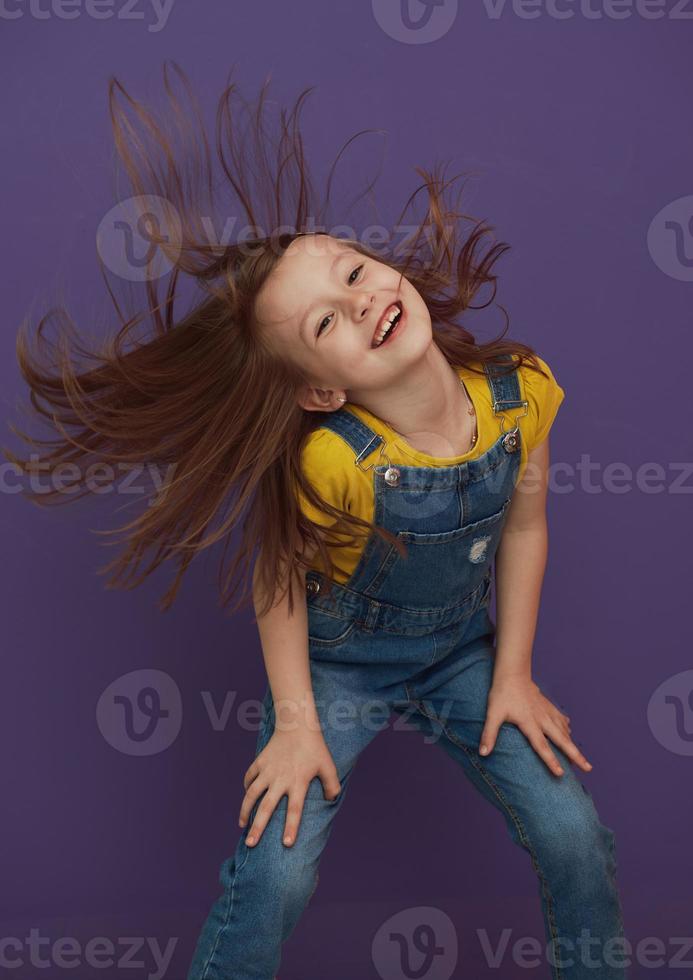 Cute little girl dancing at home photo