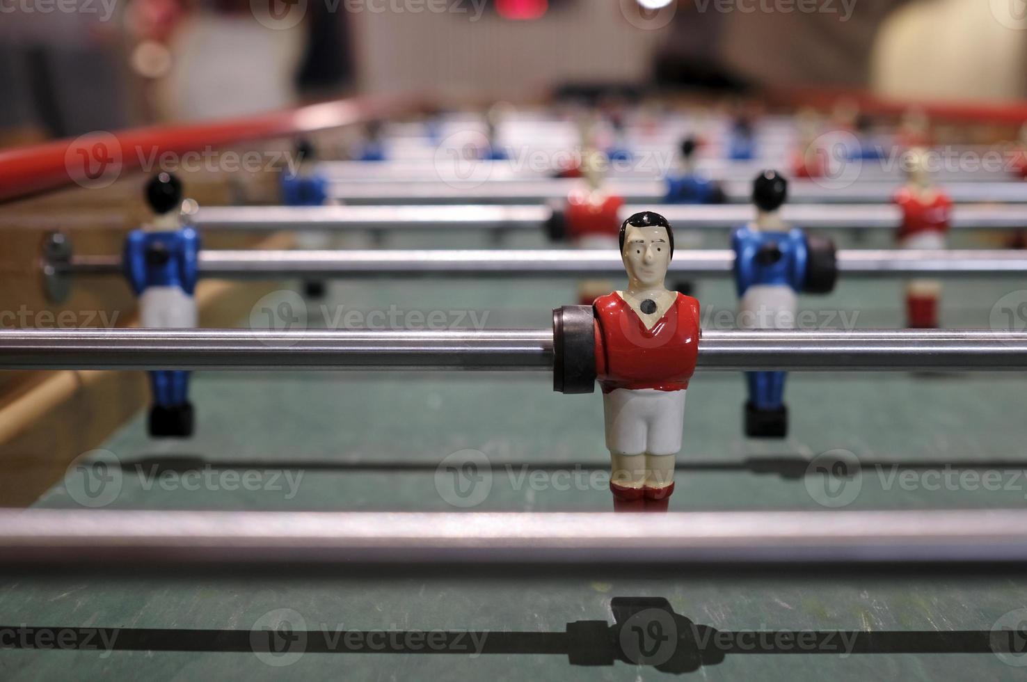 Figurine of an extra-long foosball table or table football photo