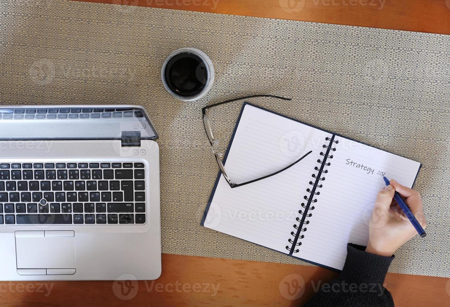 Drafting the strategy for the next year in a notebook photo